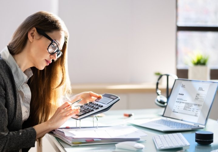 "A professional Chartered Accountant analyzing financial documents in an office setting."